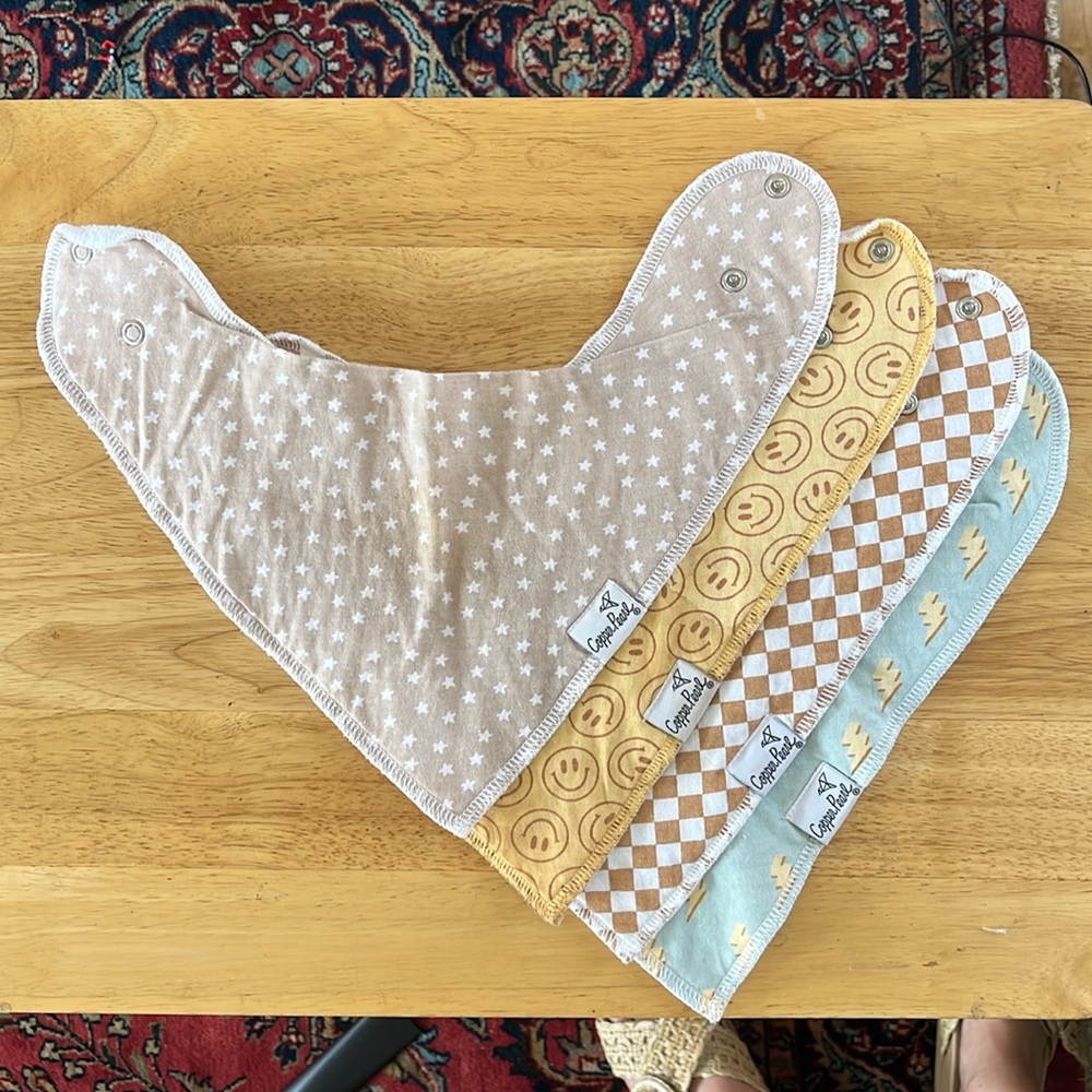 4 boy neutral copper pearl bibs.